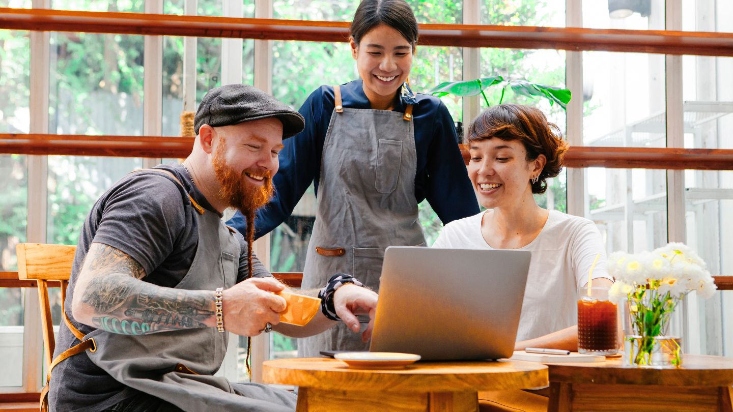 woman working on laptop choosing ecommerce platform